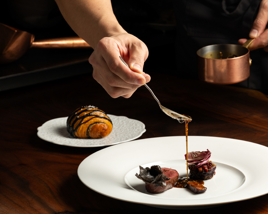 Adding sauce to a dish