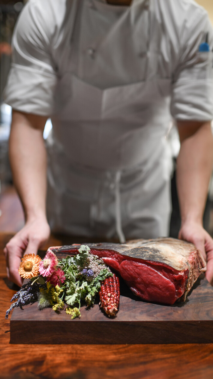 Chef holding dish